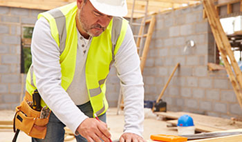 A construction worker works on a job site