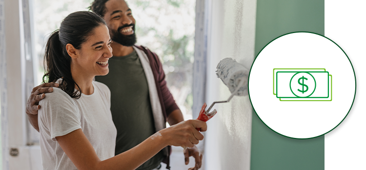 A happy couple celebrate paint their home together