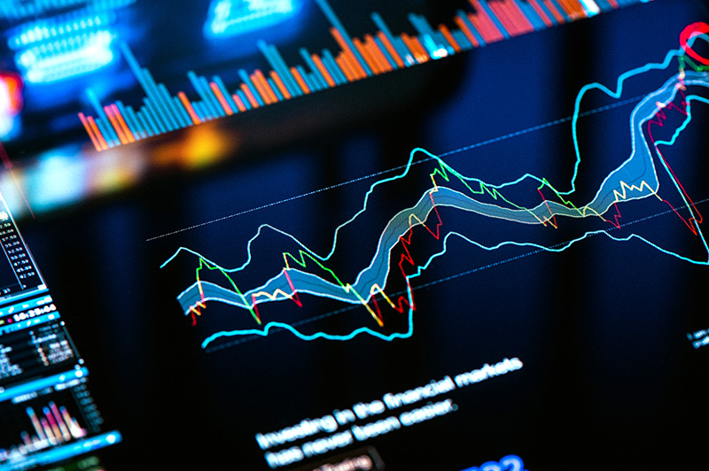 LED graphs of financial stats projected on top of each other