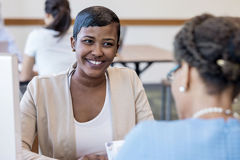 Cheerful mid adult bank employee