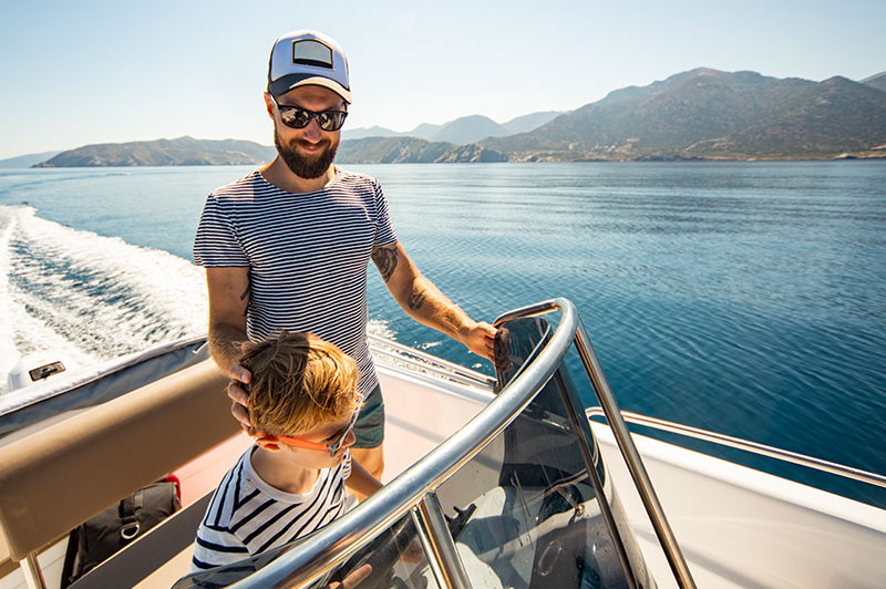 Father and son boating on the lake
