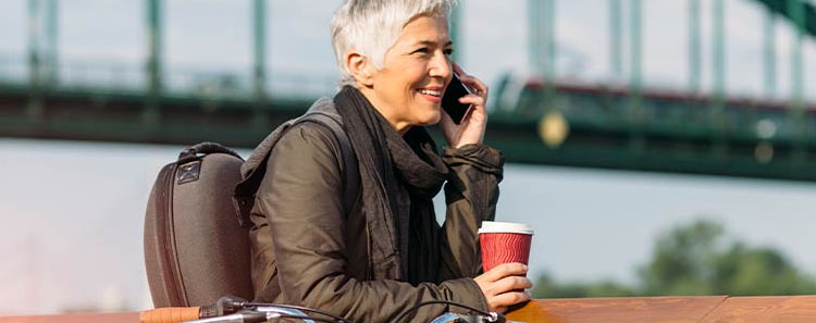 An older woman takes a phone call