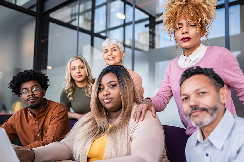 Diverse Team Working Together in Modern Co-Working Space